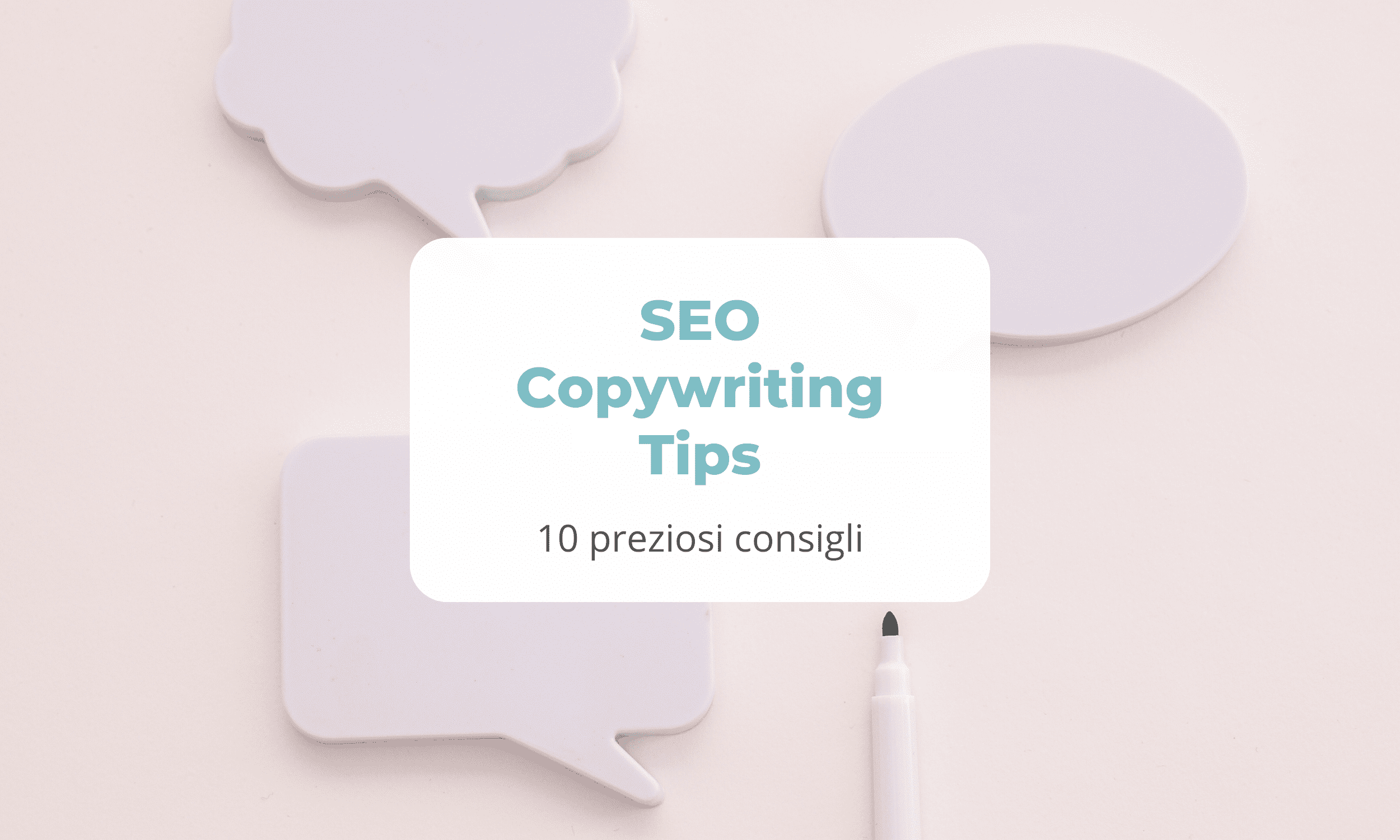 SEO Copywriting Tips: 10 preziosi consigli - su un tavolo poggiano dei block notes rosa e una penna